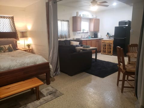 View from bedroom area into kitchen living area. Lots of natural light.