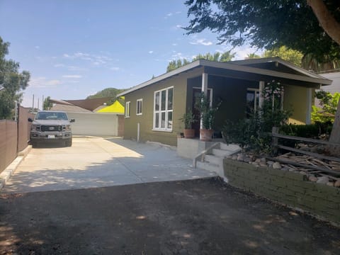The studio is at the end of the driveway to the right of the garage door.