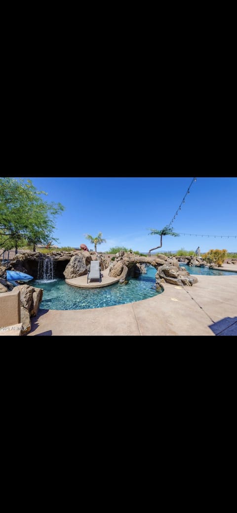 Lazy river pool w multiple waterfalls and a slide! 