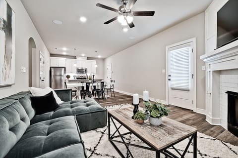 Open living/dining/kitchen area with access to driveway.