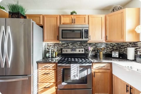 Kitchen with electric stove and oven