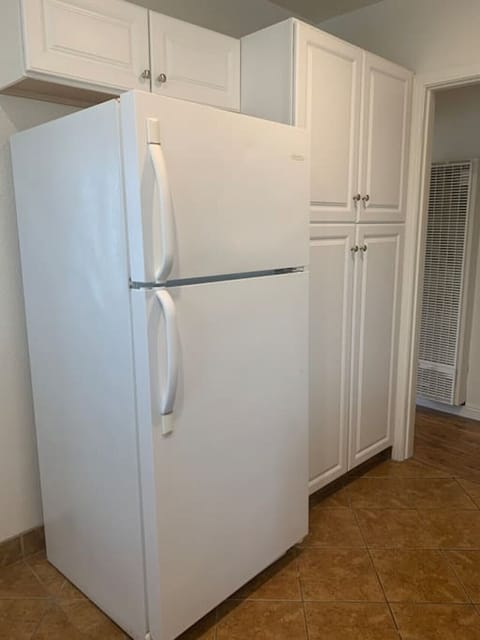 Unique kitchen space - plenty of counter space - refrigerator, microwave, oven, electric stove and all supplies needed for a home cooked meal.