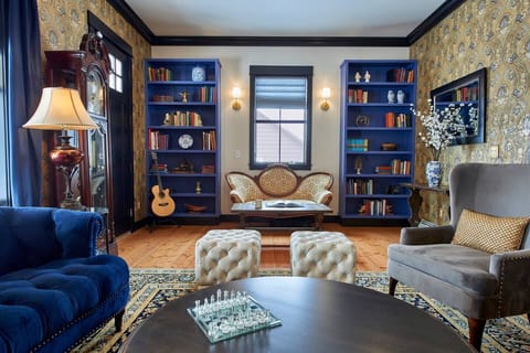 Upscale interior design throughout the house incorporates elements from the late 1800s with a bohemian flair, unique artwork, and modern-day conveniences.