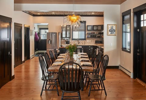 The hand-made dining room table can seat ten guests and is extra wide for ample elbow room. 