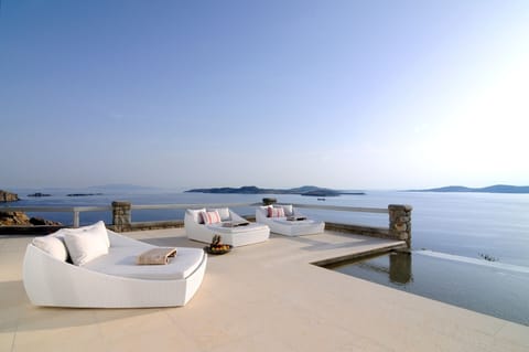 An infinity pool, sun loungers