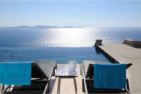 An infinity pool, sun loungers