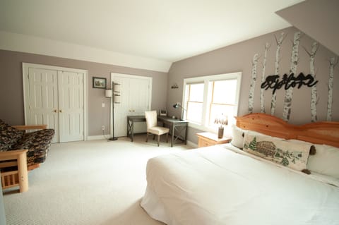 Upstairs master suite with large desk, perfect for working remotely!