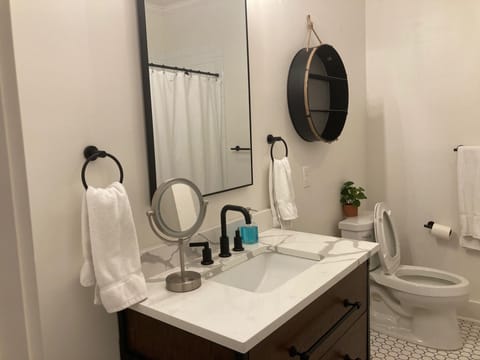 Combined shower/tub, hair dryer, towels, soap