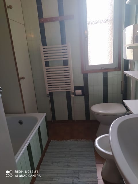 Combined shower/tub, hair dryer, towels, soap