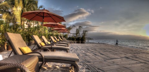 On the beach, sun loungers