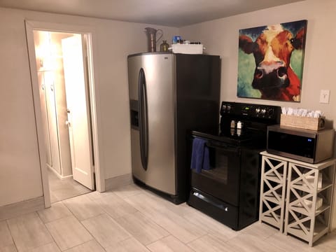 Kitchen. Full size stove and refrigerator.