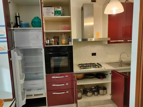 Fridge, coffee/tea maker, toaster, cookware/dishes/utensils