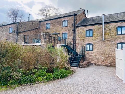 The private driveway to hold two cars and the stairs leading to the cottage.