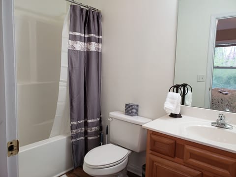 Combined shower/tub, hair dryer, towels, soap