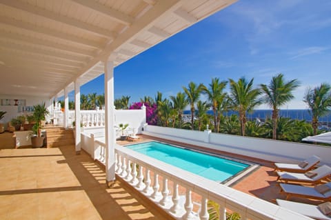 A heated pool, sun loungers