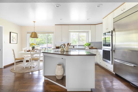 Kitchen features an island and modern appliances.