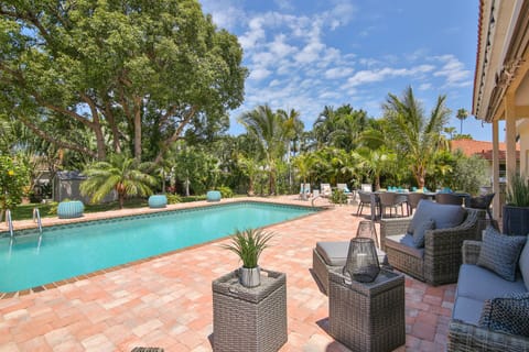 A heated pool, sun loungers