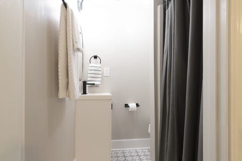 Combined shower/tub, hair dryer, towels, soap