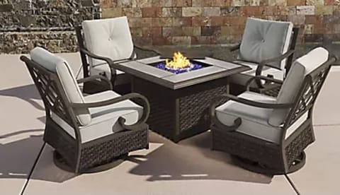 Swivel Rockers surround a gas fire pit in the yard