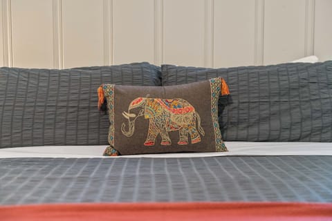 Comfortable and stylish linens in the primary king bedroom.