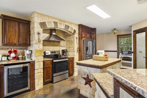 No paper plates here! The kitchen is fully stocked with cookware, dining ware, utensils, and glasses.