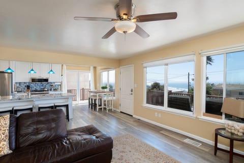 A wall of windows to let in natural light and enjoy ocean views