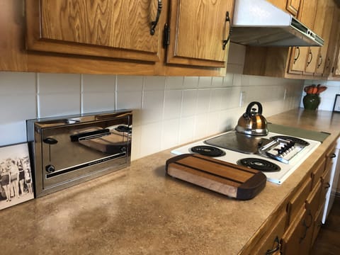 Mid-century details with stove top and plenty of counter space.