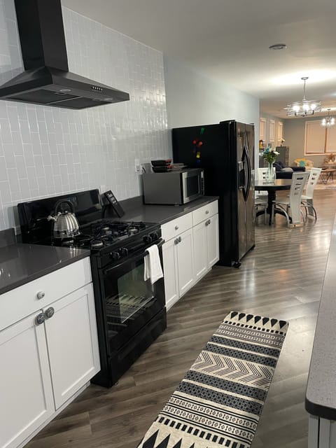 Side by side refrigerator/freezer with in door water and ice dispenser