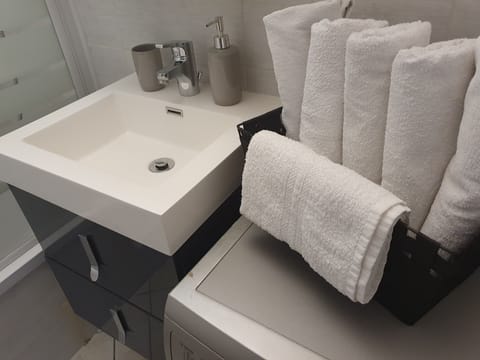 Bathtub, hair dryer, towels