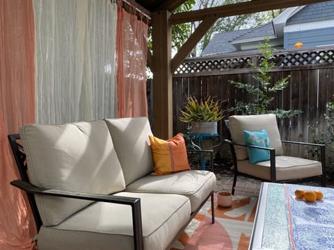 Sit under our outdoor living room ( gazebo). 
Listen to windchimes. Relax!