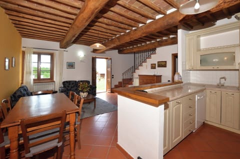 The living room with dining area and kitchen corner in the apartmnent 2