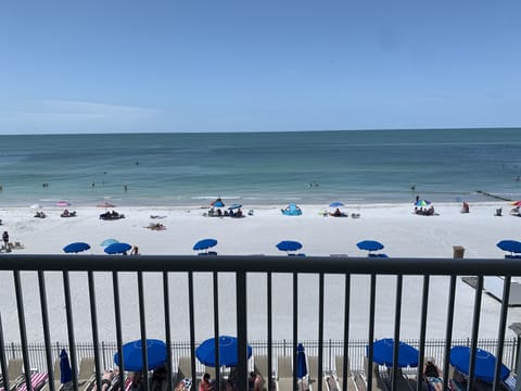 On the beach, sun loungers, beach towels