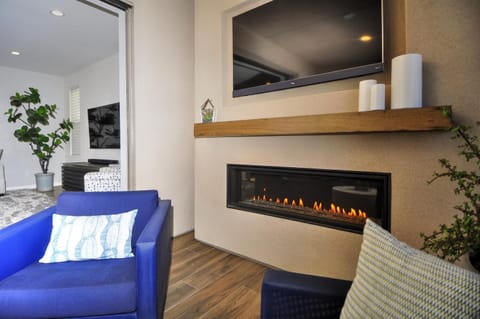 Relax by the fire on the covered balcony and watch a sports game or movie 
