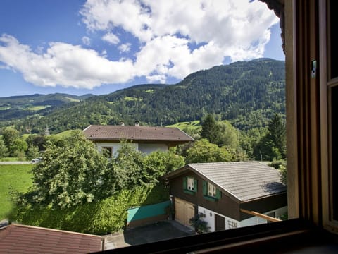 Cloud, Sky, Property, Building, Mountain, Window, Wood, Tree, Highland, Biome