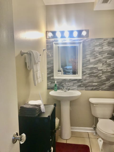 Combined shower/tub, hair dryer, towels, soap