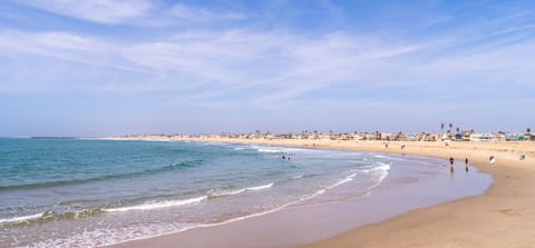 On the beach, sun loungers, beach towels