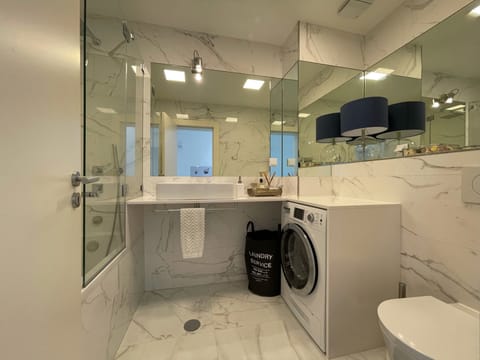 Combined shower/tub, hair dryer, towels, soap