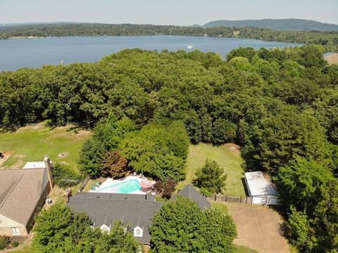 Aerial view of yard and short path to lake