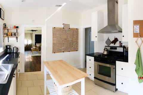 Kitchen view into living space- coffee station and area map