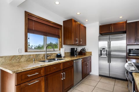 Third floor fully equipped kitchen with stainless appliances.