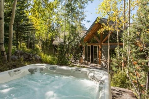 Hot tub and view of sliding doors to home