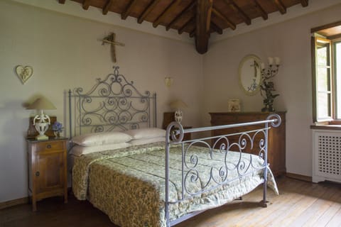 The beds are ancient Tuscan wrought iron doubles