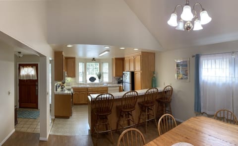 Off the kitchen is the dinning area with table that seats 6