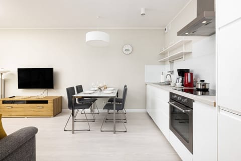 Kitchenette with plenty of kitchen utensils and dishes. 