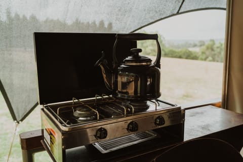 Fridge, coffee/tea maker, toaster oven, cookware/dishes/utensils