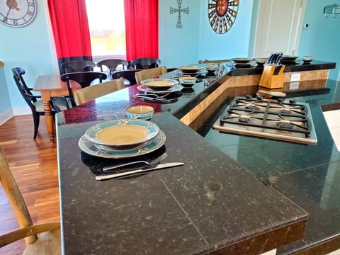 Spacious island bar and dining table, seat 16 comfortably with table leaf added.