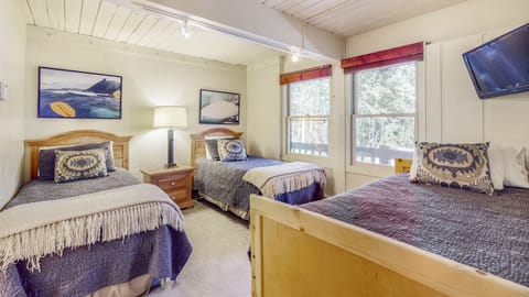 Second bedroom featuring three single beds