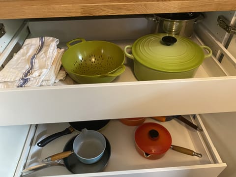 Le Creuset pots and pans, kitchen towels