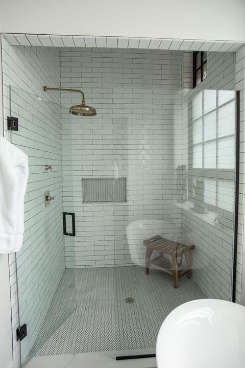 The oversized walk-in shower provides a luxury spa experience every day of your stay here.