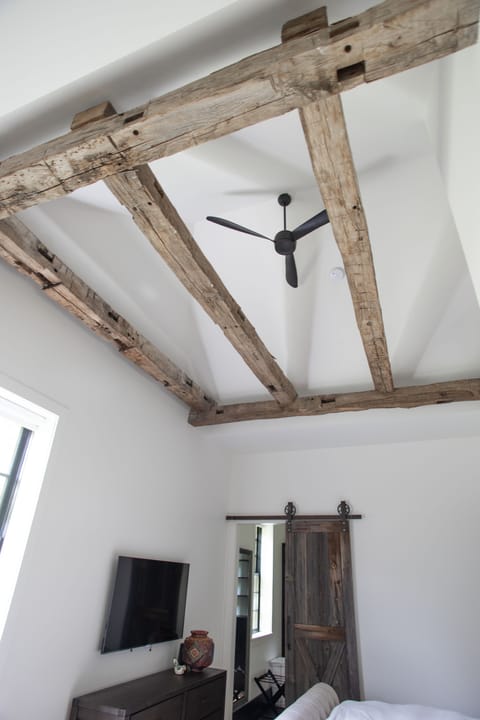 Antique beams, barn doors, and many other stylish design accents can be found throughout the home.